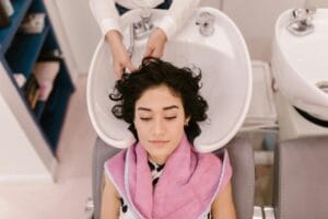 A woman enjoys a relaxing hair spa treatment at lavant beauty norwood nj